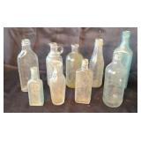 Assorted vintage bottles.