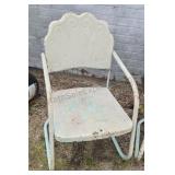 Vintage metal patio chairs with scalopped back.