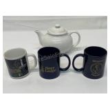 Coffee mugs with a ceramic teapot.