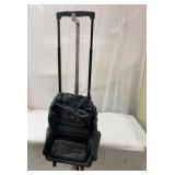 Travel pack with long handle and wheels.