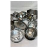 Various kitchen pieces. Cups. Bowls. Stainless