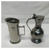 2 vintage pitchers 1 is steel and the other is