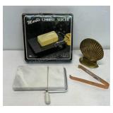 Marble cheese slicer and brass clam shell and