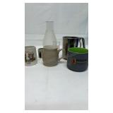 Various mugs, a flower sifter mug, Biggby coffee