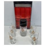 6 baller glasses and a glass shaker