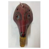 Handcrafted wooden folk art mask from Guatemala.