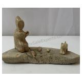 handcrafted Inuit sculpture featuring a figure