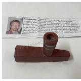 This is a hand-carved ceremonial pipe made from