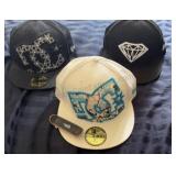 Group of DC hats & tech deck board