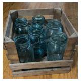 Crate of Blue Glass Mason Jars