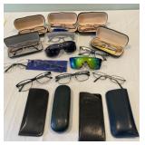 Lot of eyeglasses and cases