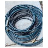 Lot of 2 25 ft air hoses with couplers.