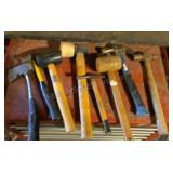 Assorted hammers and one axe.