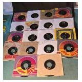 Elvis Presley 45 RPM records. Some in original