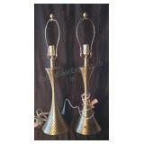 Table lamps in a gold art deco style. No shades.