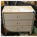 Three drawer dresser. Top is scratched. 30x32x18.