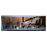 Vintage tools and other items on one shelf. Buyer