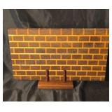 Two tone wood cutting board in brick pattern.
