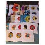 45rpm records. Some in original sleeves. Artists