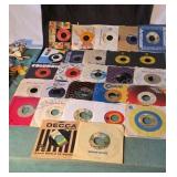 45rpm records. Some in original sleeves. Artists