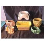 Assorted ceramic and clay planters, including