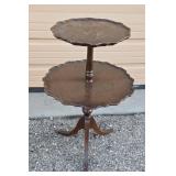Two tiered pie table with metal claw feet. Top