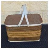 Vintage picnic basket with faux wicker outside.