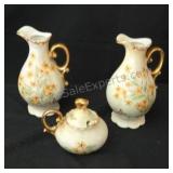Vintage hand-painted porcelain creamers and