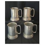 Aluminum Playboy mugs with clear plastic bottoms.