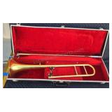 Vintage brass trombone with case.
