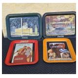 Metal Coca-Cola trays.