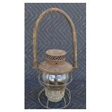 Antique railroad lantern with wood handle.