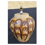 Large ceramic table lamp with brown drip design.