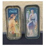 Metal Coca-Cola trays.