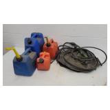 4 gas cans and 2 military fuel bladders