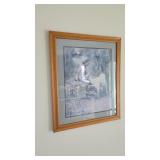 Framed girl and goat artwork
