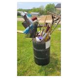 Barrel of yard and hand tools