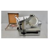 Univex meat slicer with extra blades