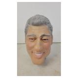 Bill Clinton rubber mask on glass head