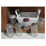 Basket of antique spice jars