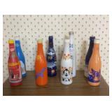 Artistic metal soda collector bottles (8)