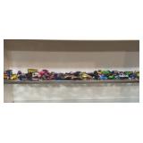 Shelf of Hot Wheels, toy cars