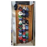 Assortment of baseball caps, rack included