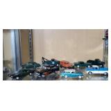 Assorted toy trucks, cars (10)