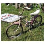 Pink youth Huffy bicycle with banana seat