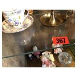 Tea cups and plates, candle,