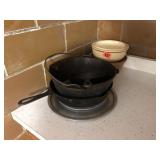 Cast Iron Pans, serving plates, and bowls