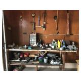 Work bench and contents on bench and wall