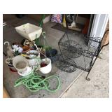 Garden lot: seeder, iron flower stand, hose,