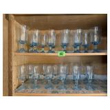 Blue stemware collectiontwo shelves of matching